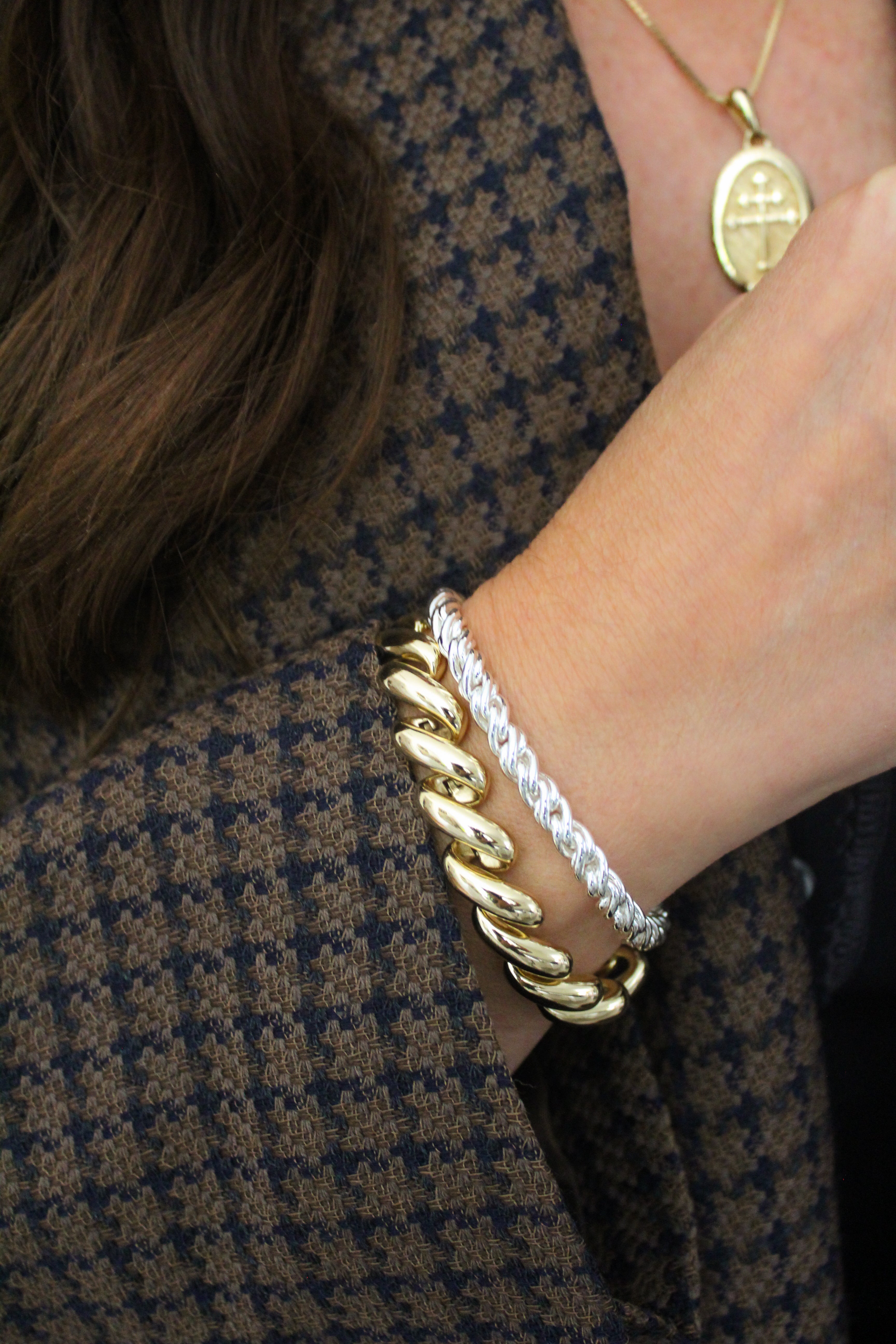 Model wearing the silver Adriana bracelet paired with the gold paige bracelet.