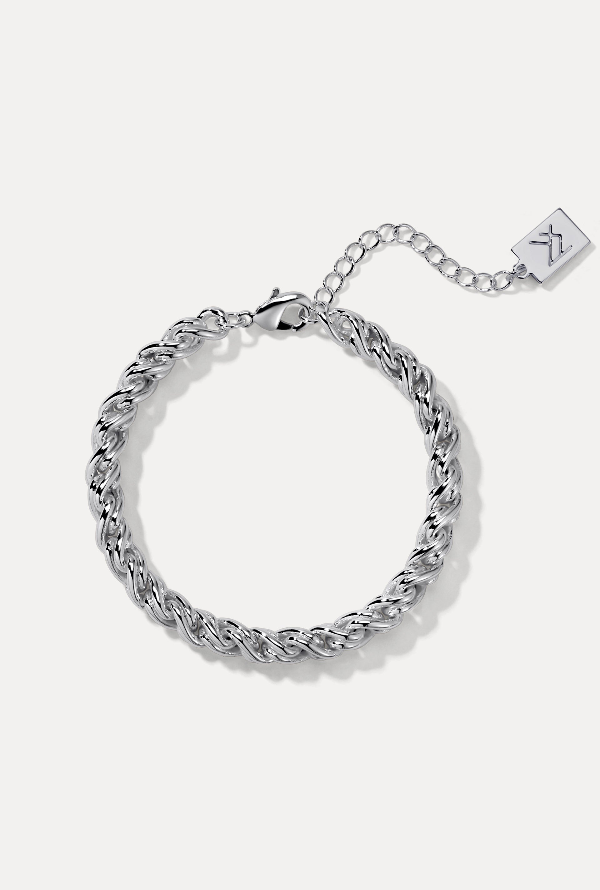 Sterling silver Adriana Bracelet on white background showing 6mm rope chain, clasp, and logo tag.