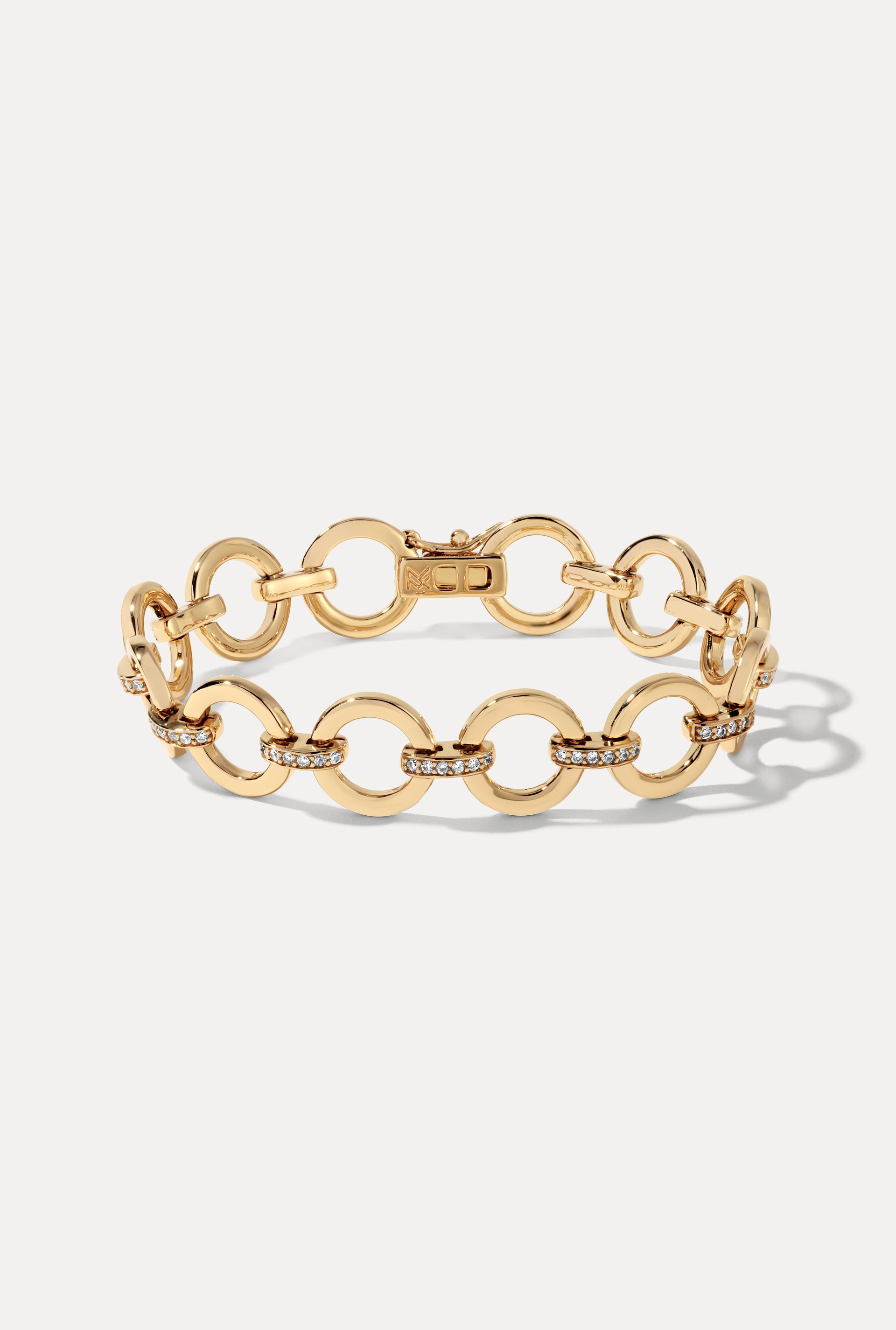 Gold Aria Bracelet with pavé CZ links displayed in an oval on a clean white background.