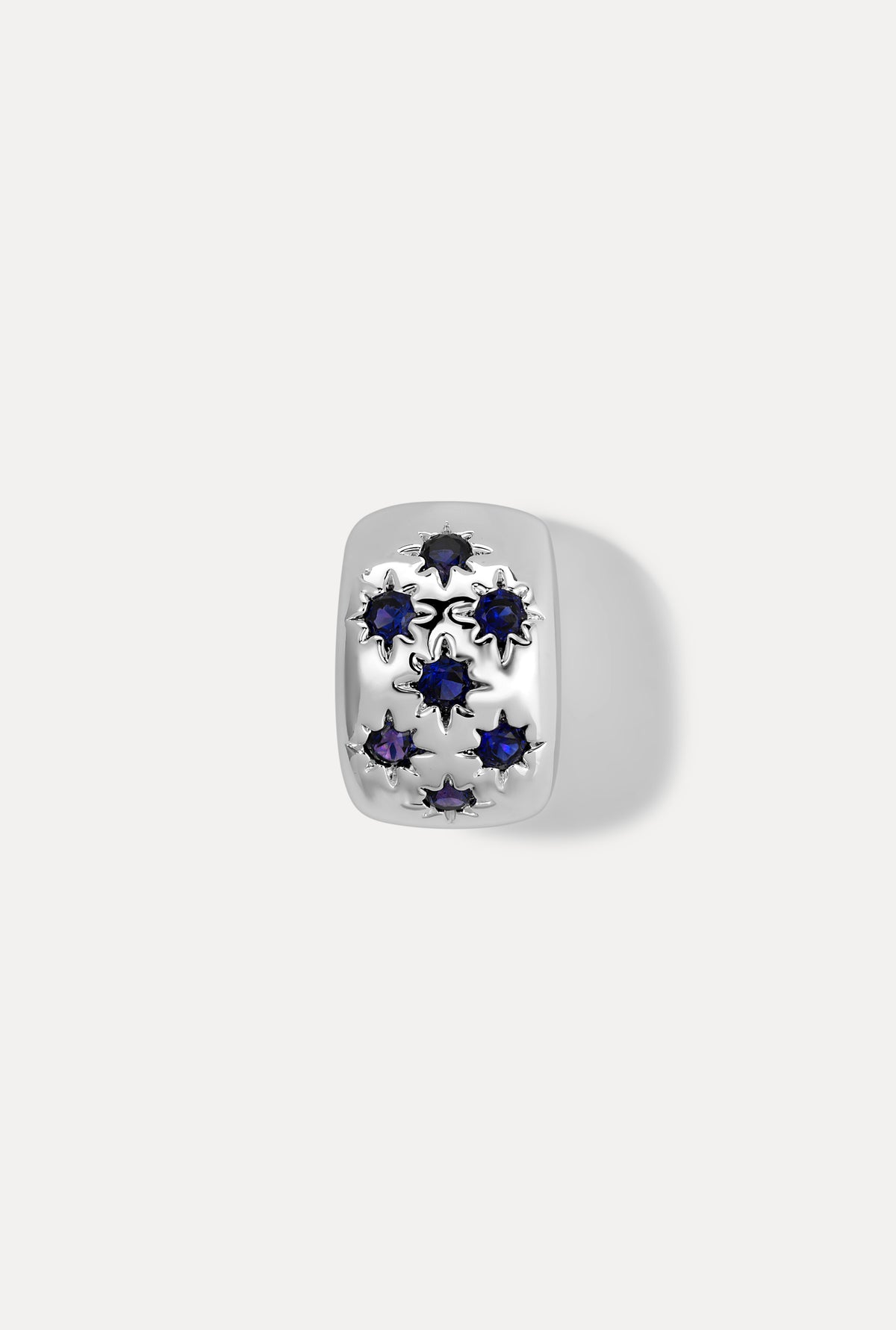 Silver Celeste slider charm with sparkling sapphire stones on white background