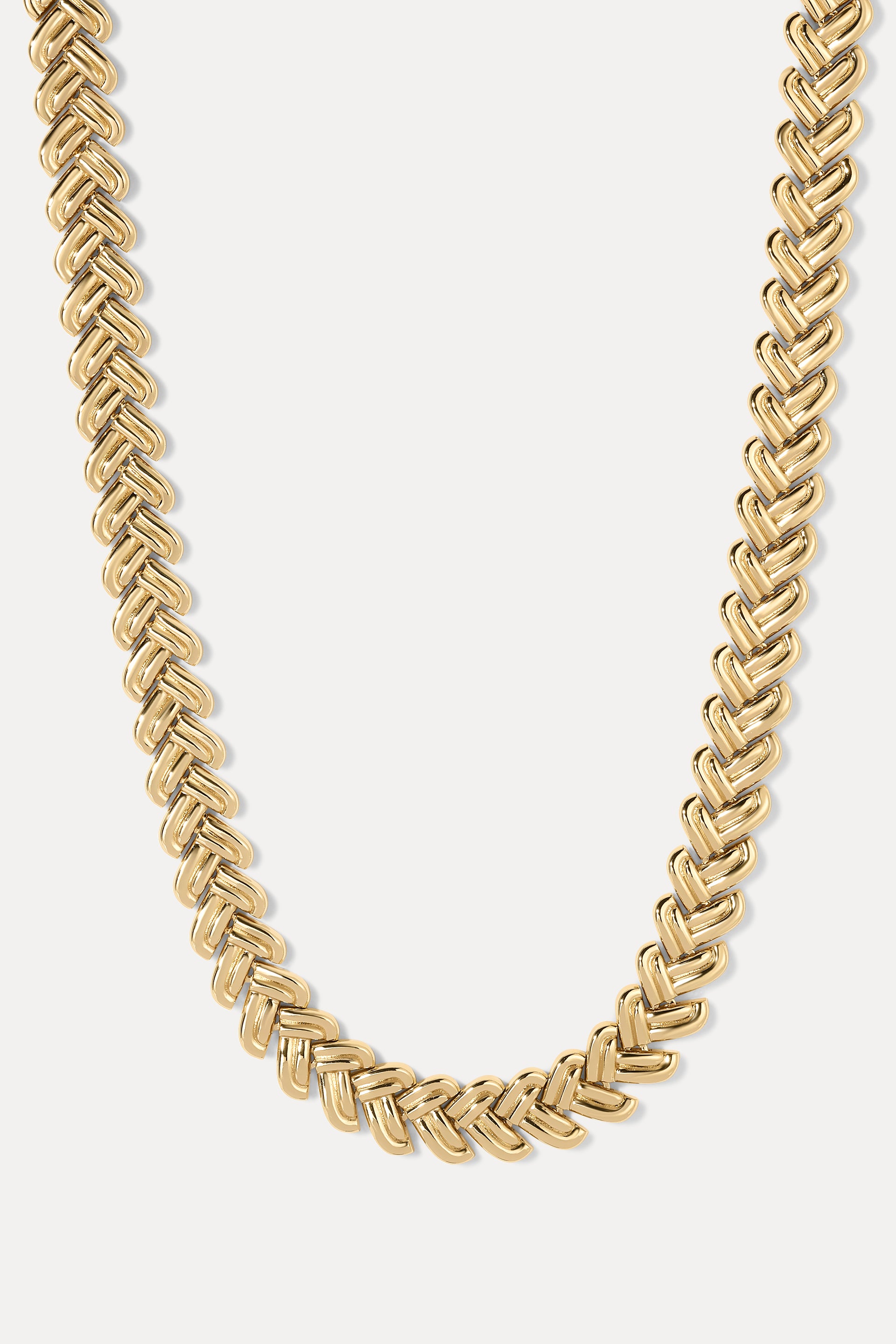 Estelle Necklace in gold displayed in a U-shape loop on a plain white background.