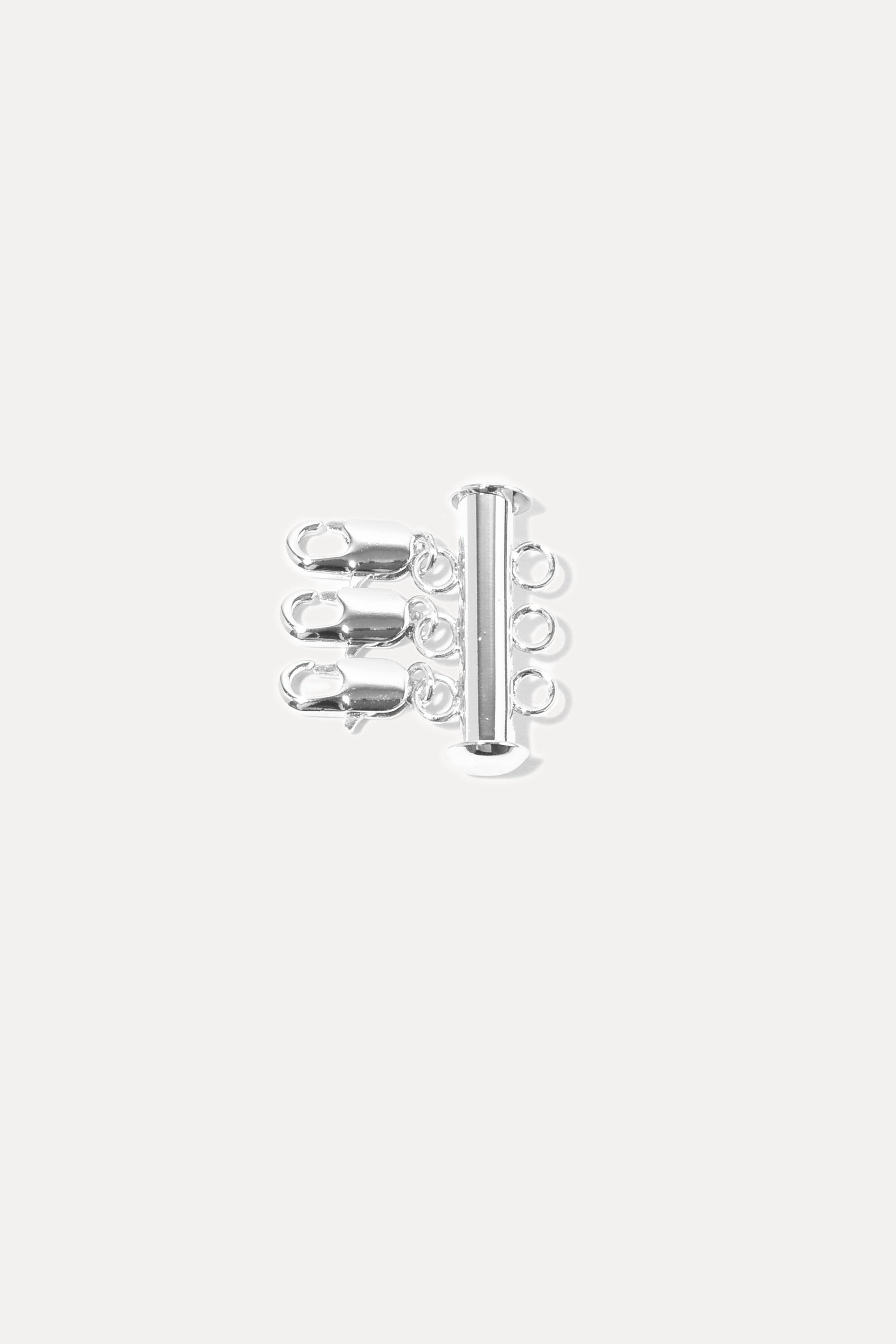 Silver Layer Slayer necklace detangler clasp with three attachment rings, displayed on a white background.