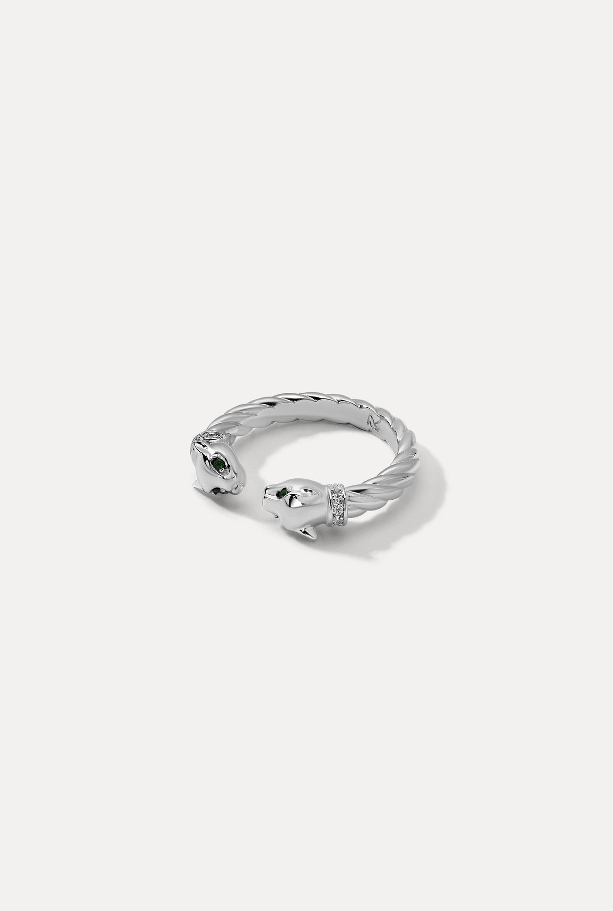 Silver open Panther Ring with twisted rope detail and green gemstone eyes on white backdrop.