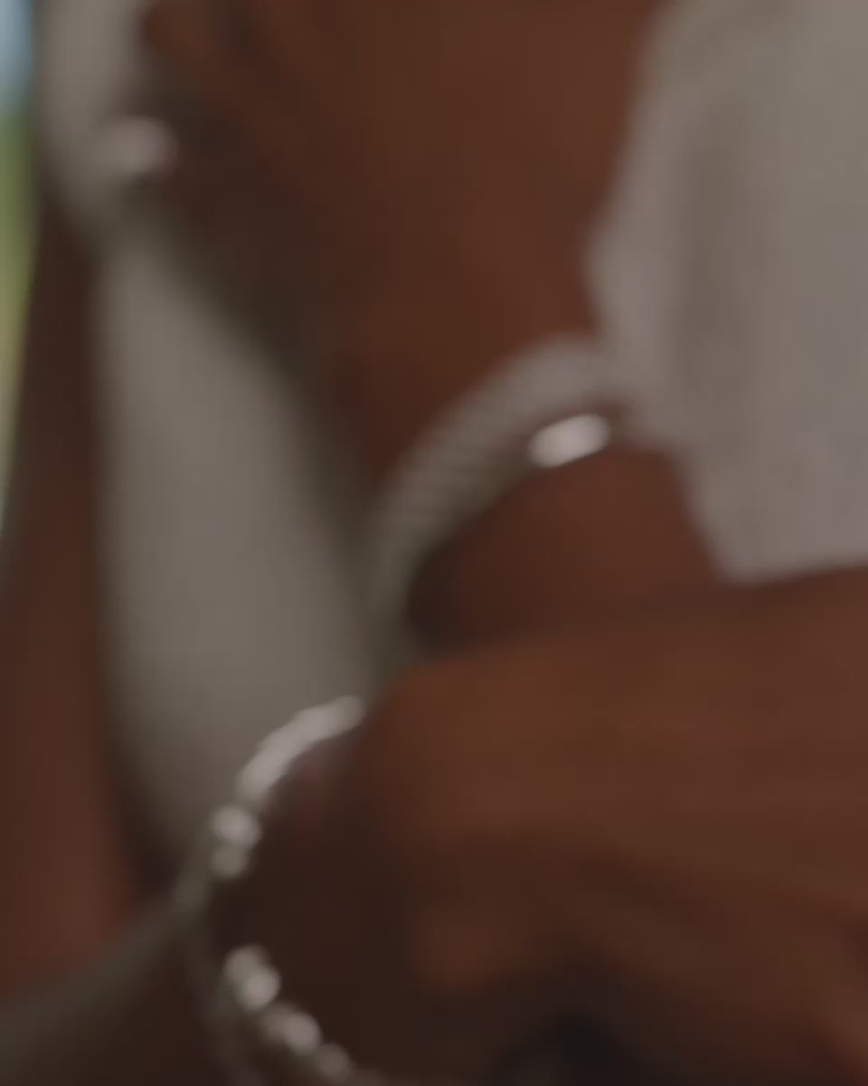 close up video of a model wearing the beautiful camryn bracelet in silver paired with the silver panther cuff.