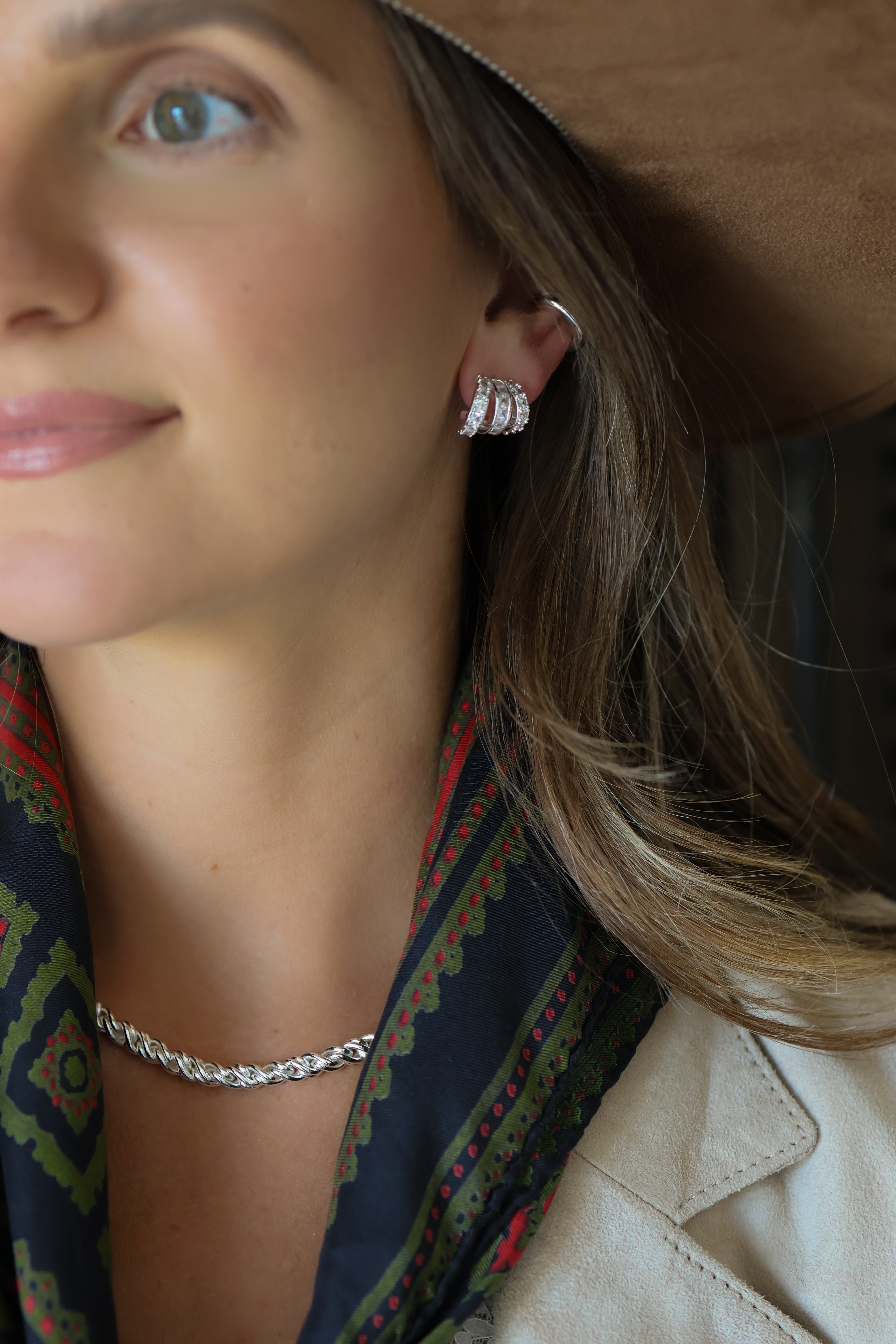 Model photo showing the Adriana Silver Rope Chain Necklace paired with silver earrings.