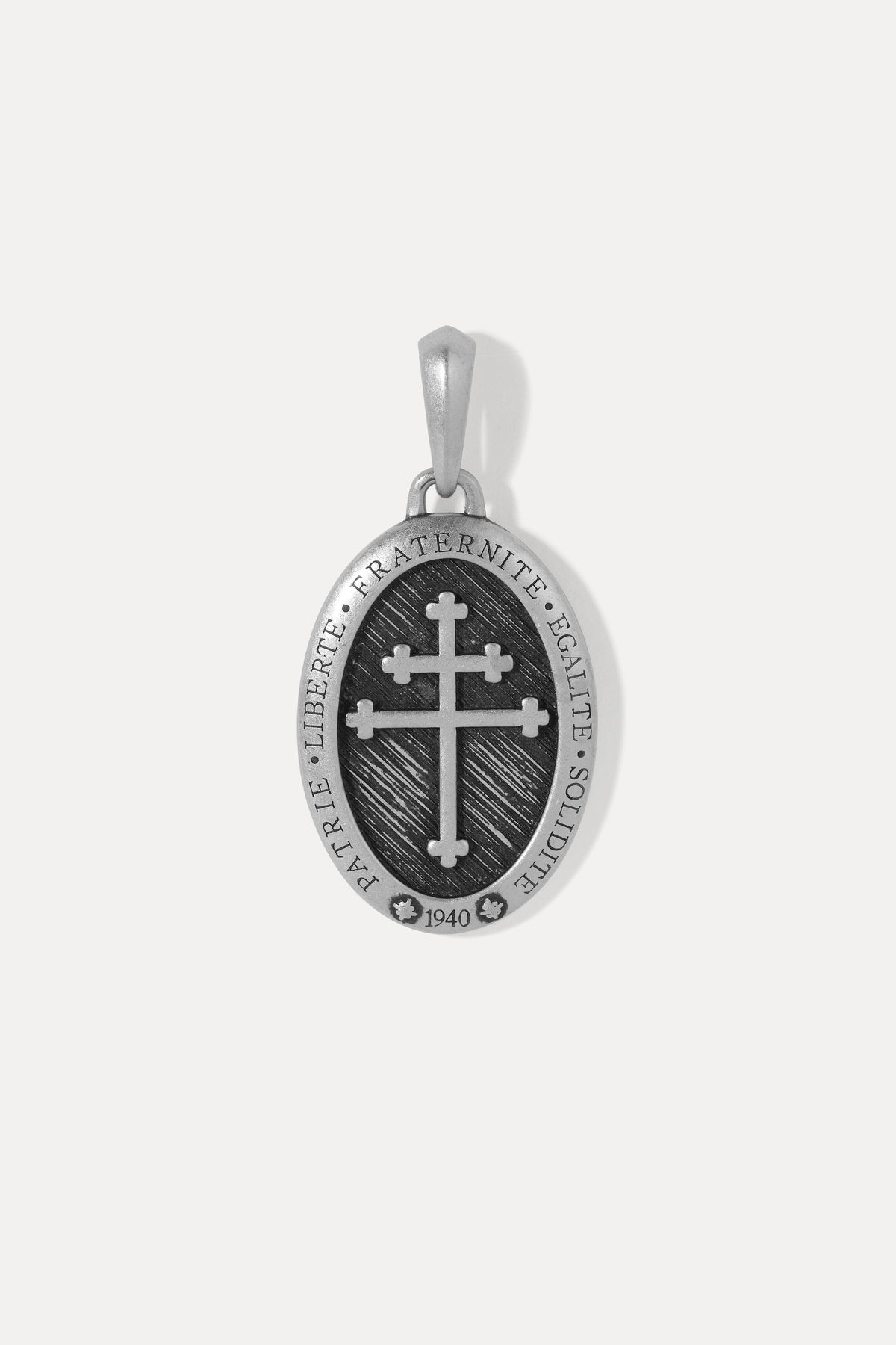 A sterling silver oval pendant featuring a black enamel background with a raised silver cross in the center.