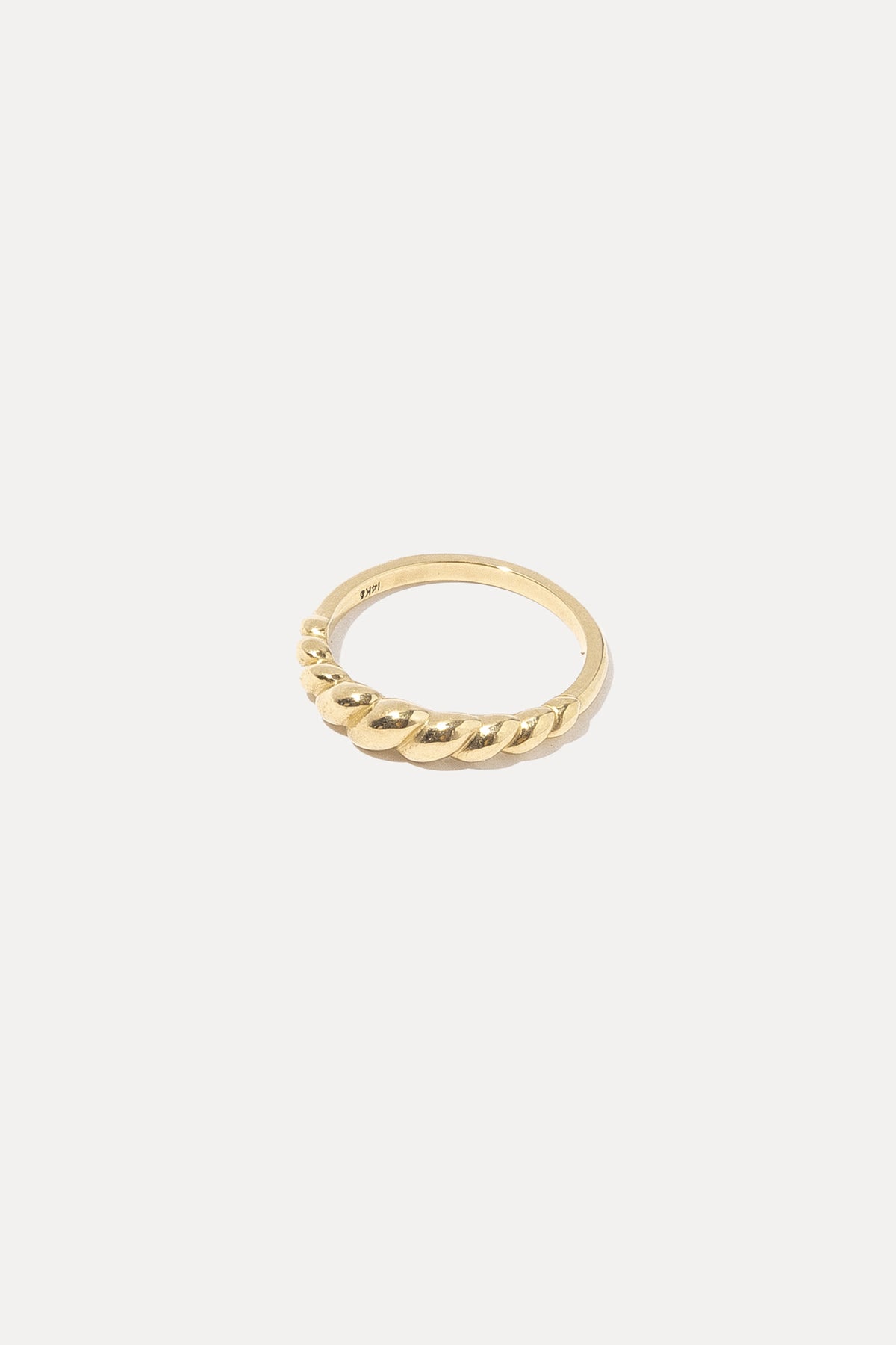 14K gold twisted rope band ring displayed on a plain white background.